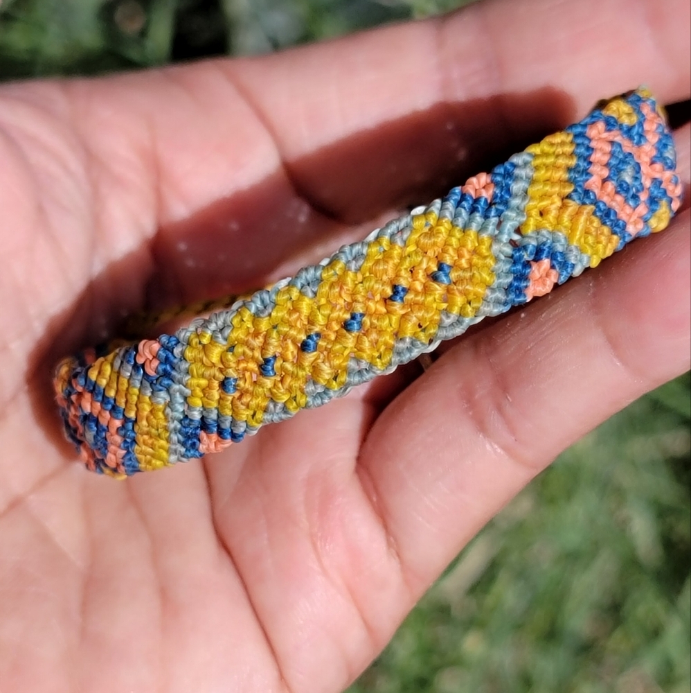 Pura Vida wide patterned blue, pink, and yellow bracelet